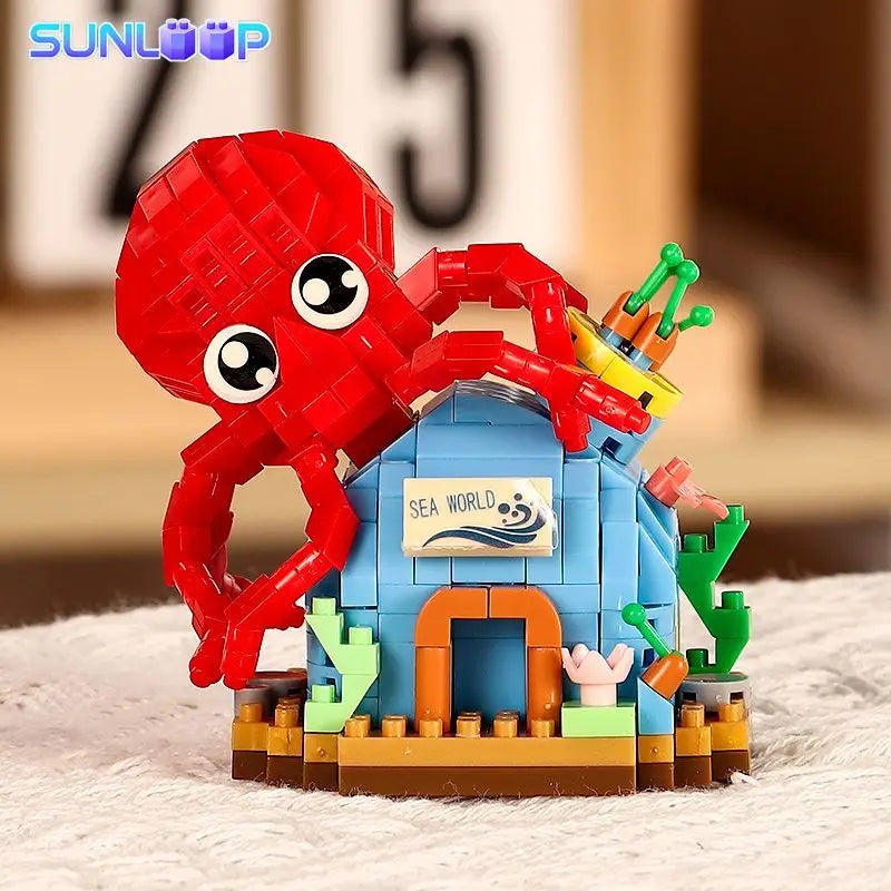 A set of ocean animal building blocks featuring a red crab, a yellow shark, and a blue clownfish.