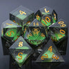 A collection of seven polyhedral liquid core resin dice in various colors and angles.