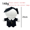 A white plush doll wearing a black outfit with gold accents, shown from the front.