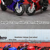 A set of three die-cast motorcycle models in blue, red, and black, showing various parts like the handlebar linkage and wheel