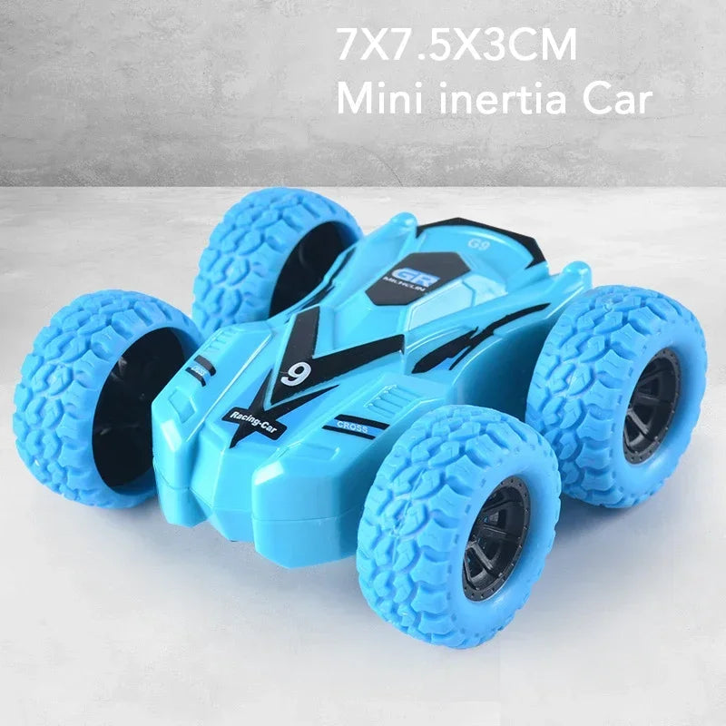 A blue mini inertia car toy with large tires is shown on a white surface.