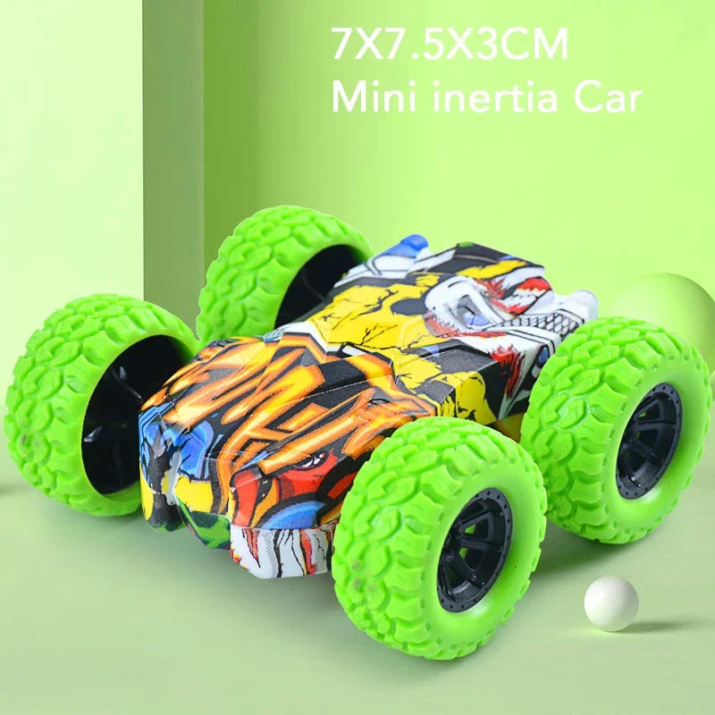A small, colorful inertia car toy with green wheels is shown on a light green background.