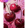 A close-up of a glossy, deep red cherry fruit with a stem against a pink background.