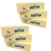 A collection of four rectangular butter squishy stress relief toys labeled 4oz salted butter with net weight 113g
