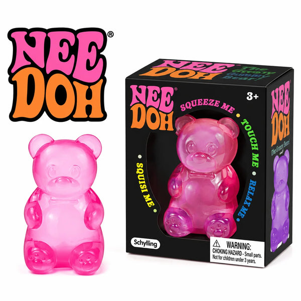 Un ours en caoutchouc rose jouet anti-stress de la ligne Nee Doh avec sa boîte d'emballage.