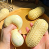 A hand holds a yellow squishy stress ball with a textured surface, demonstrating its soft and crunchy feel.