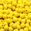A pile of bright yellow natural wooden beads for jewelry making and DIY crafts.