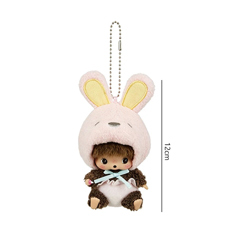 A pink fluffy cartoon rabbit plush with yellow ears and a brown face, attached to a silver chain.