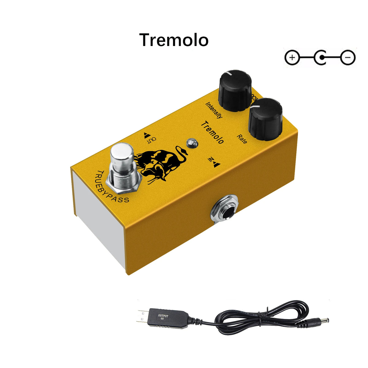 A yellow Tremolo guitar pedal with controls and an output jack, shown next to a cable.