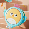 A cute, light blue owl-shaped musical drum for kids with pink accents, shown in a close-up view.