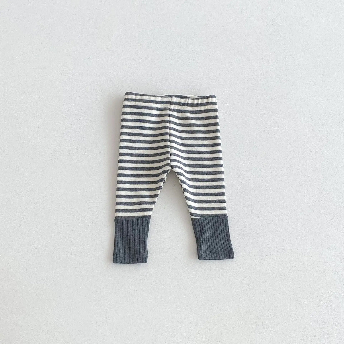 Gray and white striped baby leggings with a dark gray cuff design.