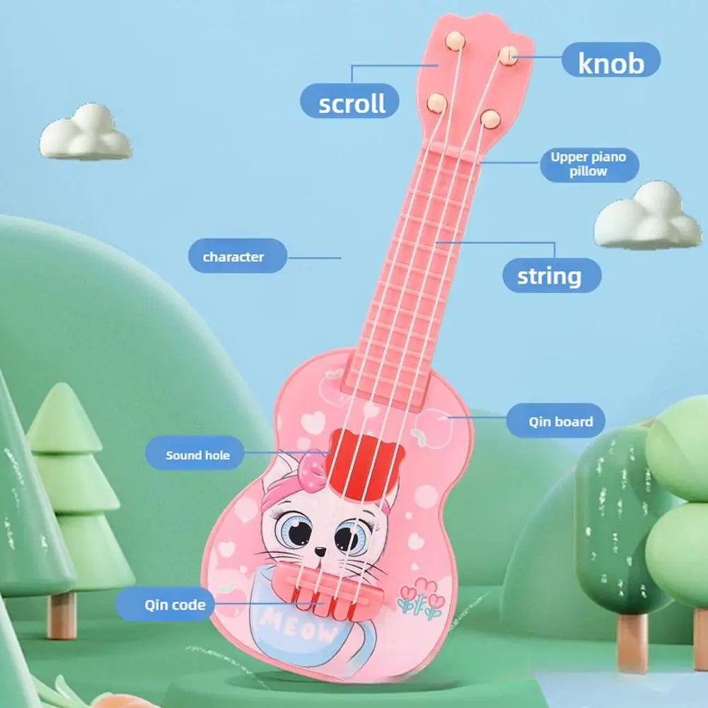 A pink mini ukulele toy featuring a cat character and a scroll mechanism is shown in a green outdoor setting.