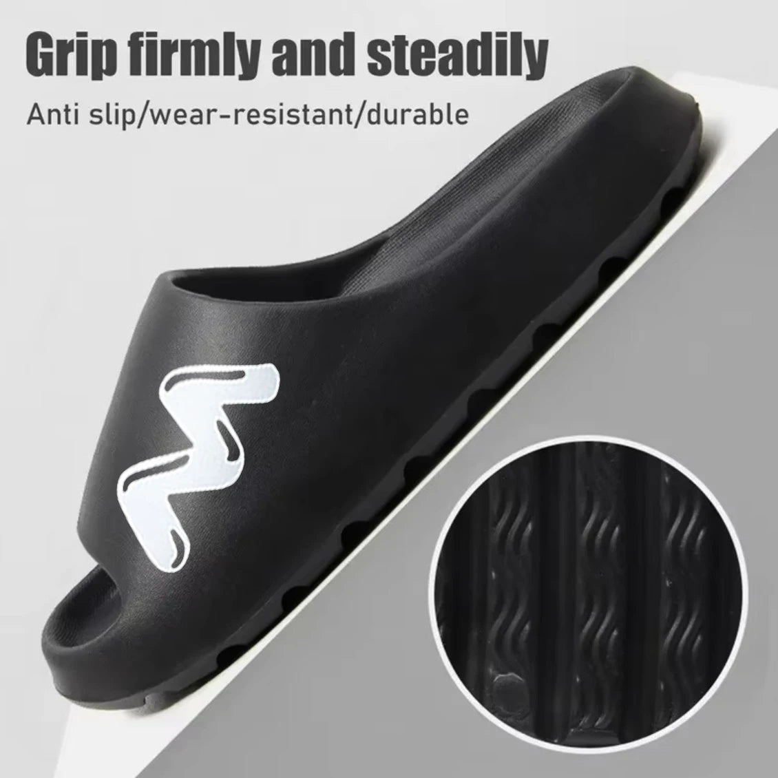 Black EVA slide slippers with a non-slip sole showing the tread pattern.