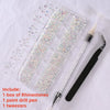 A box of rhinestones, a point drill pen, and tweezers are displayed on a white surface.