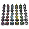 A set of black acrylic dice showing various numbered faces for tabletop role-playing games