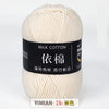 A ball of cream colored milk cotton yarn labeled with Chinese characters and a YIMIAN brand mark.