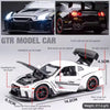 A white Nissan GTR R35 diecast model car showing various features like headlights, doors, and trunk with tail light effects.