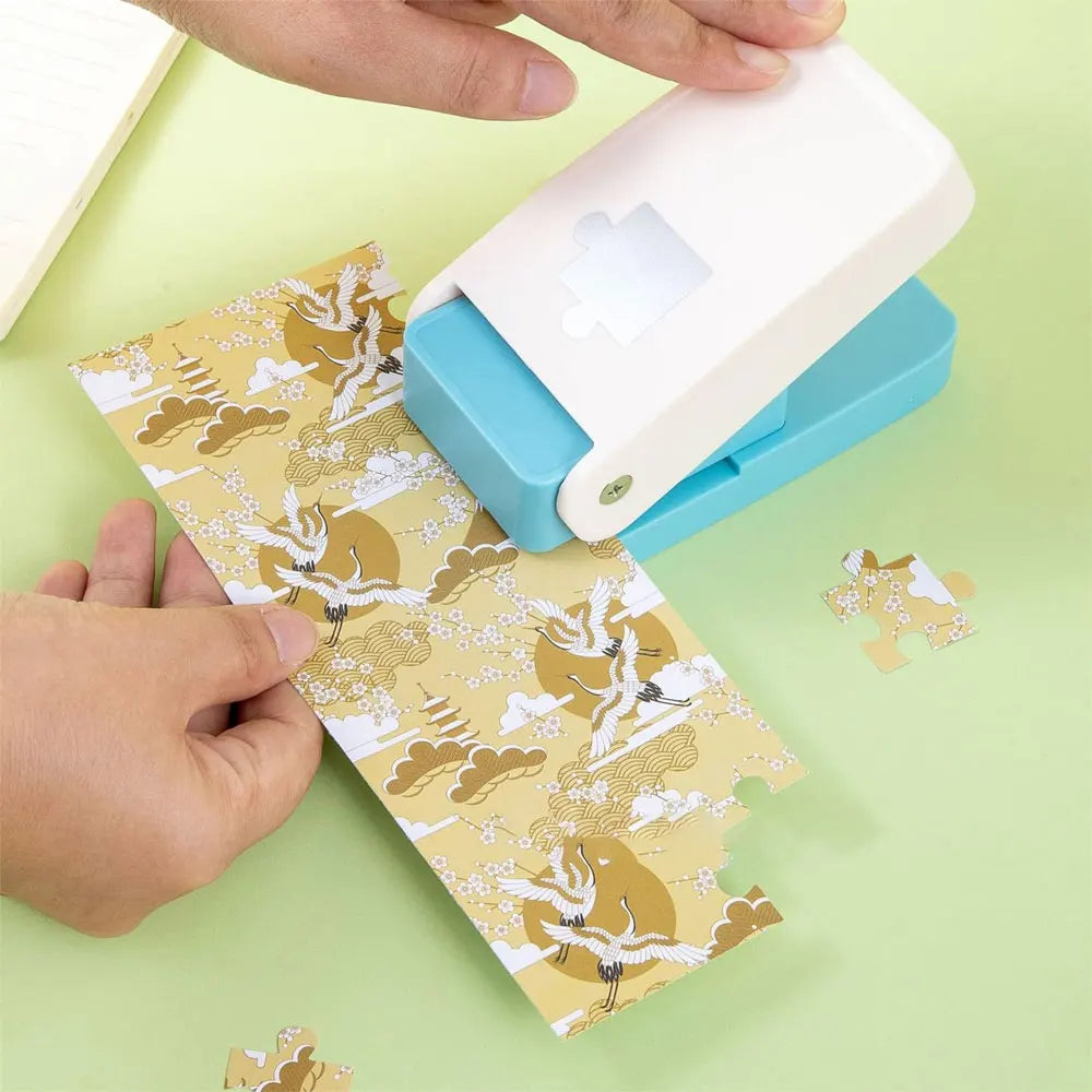 Hands are assembling a DIY puzzle making tool for crafts and scrapbooking with patterned paper.