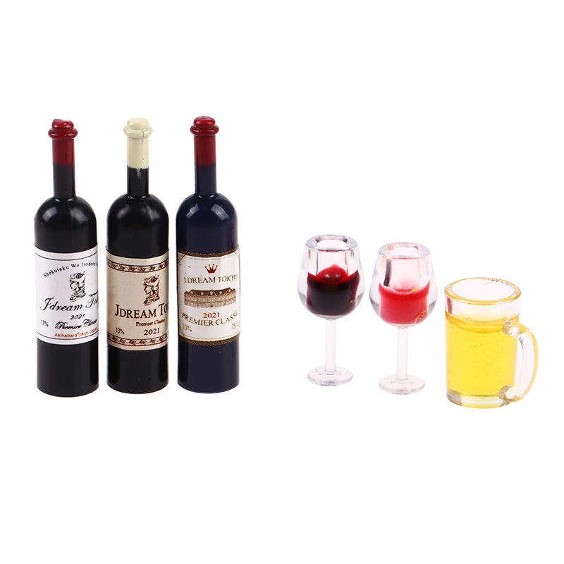 A set of five miniature resin wine bottles and glasses for a dollhouse display.