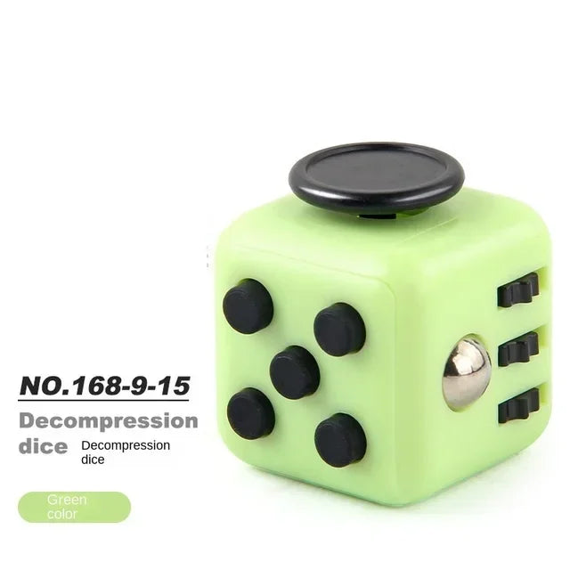 A lime green decompression die or fidget cube with a black top and silver accents.