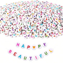 A pile of colorful letter and number acrylic beads for jewelry making