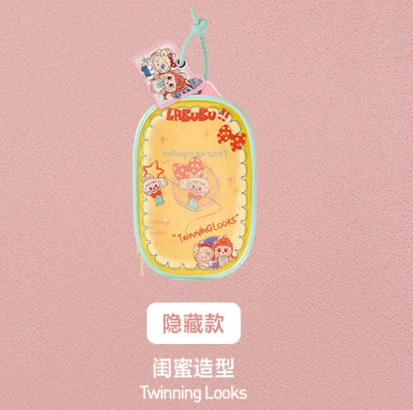 A yellow oval pendant keychain featuring a cute character design from the LABUBU The Monsters Hair Salon Series doll line.