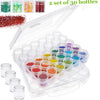 A clear plastic storage box containing 30 round bottles of various colored glitter and pigments.