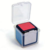 A clear plastic box containing a red mini magic cube puzzle.