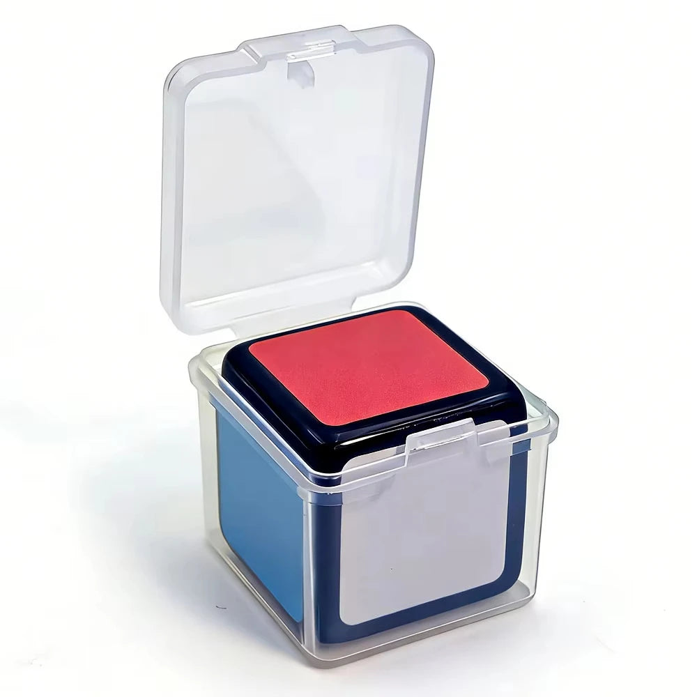 A clear plastic box containing a red mini magic cube puzzle.