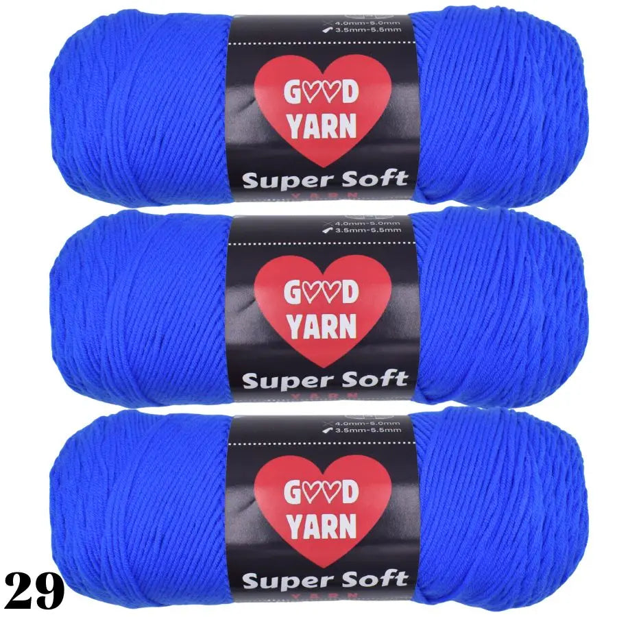 Three skeins of Super Soft blue yarn labeled GVD YARN for crochet and knitting