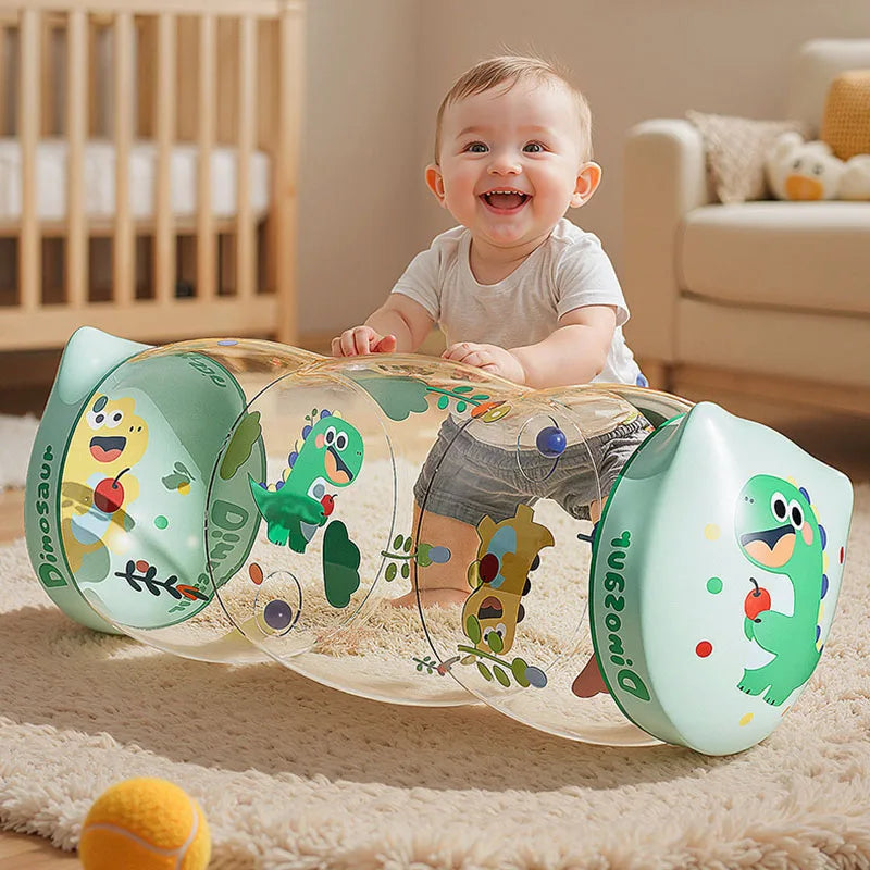 A transparent silicone Montessori baby crawling roller toy with dinosaur designs is placed on a soft rug.