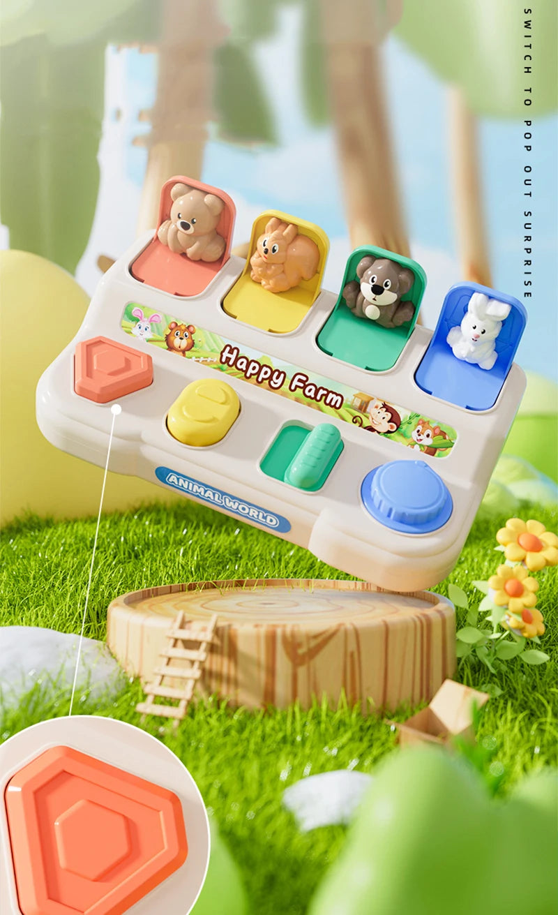 A white Montessori pop-up animal toy featuring various stuffed animals in colorful compartments set in a grassy outdoor envir