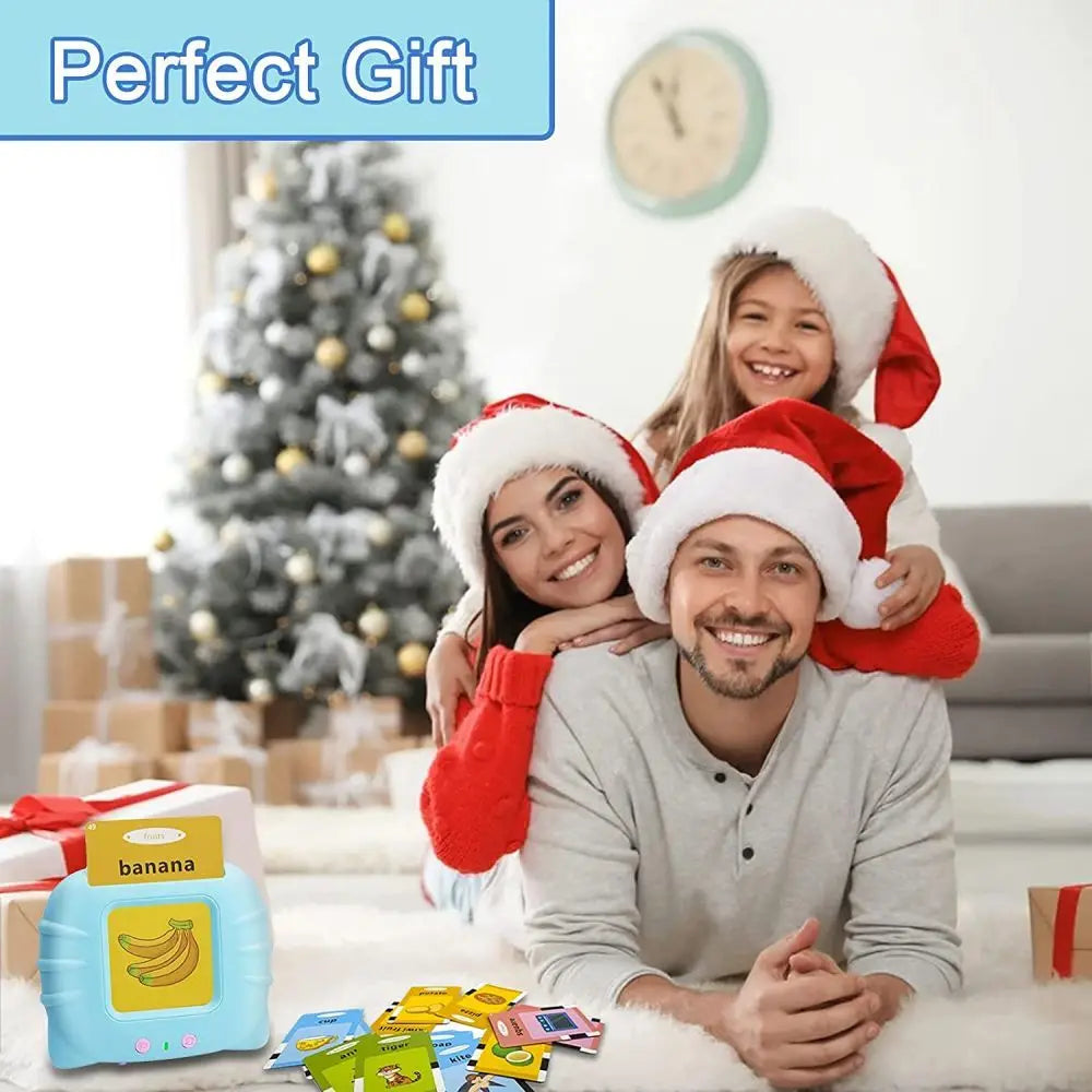 A man and a woman smiling while holding colorful flash cards and a banana-shaped toy.