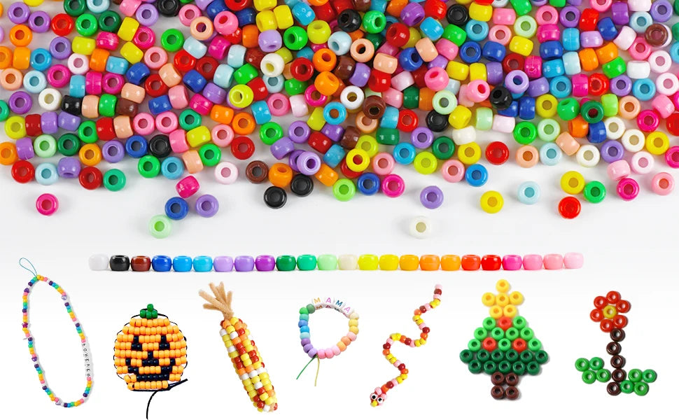 A variety of colorful pony beads in various shapes and colors are displayed alongside craft items like a pumpkin, corn, and f