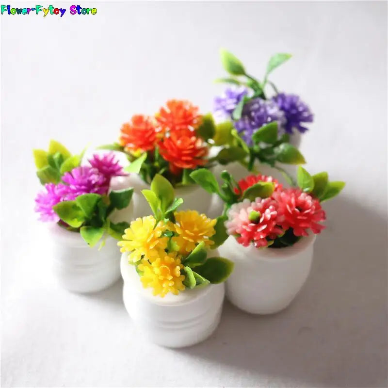 A collection of miniature potted flowers in various bright colors like orange, purple, and yellow for dollhouse decor.