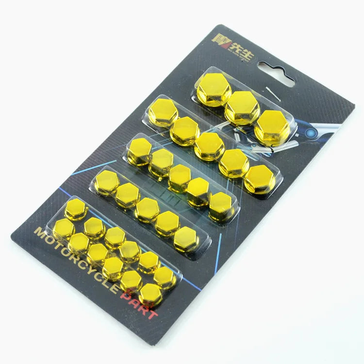 A set of gold decorative screw caps packaged in a black plastic pouch for motorcycle parts.