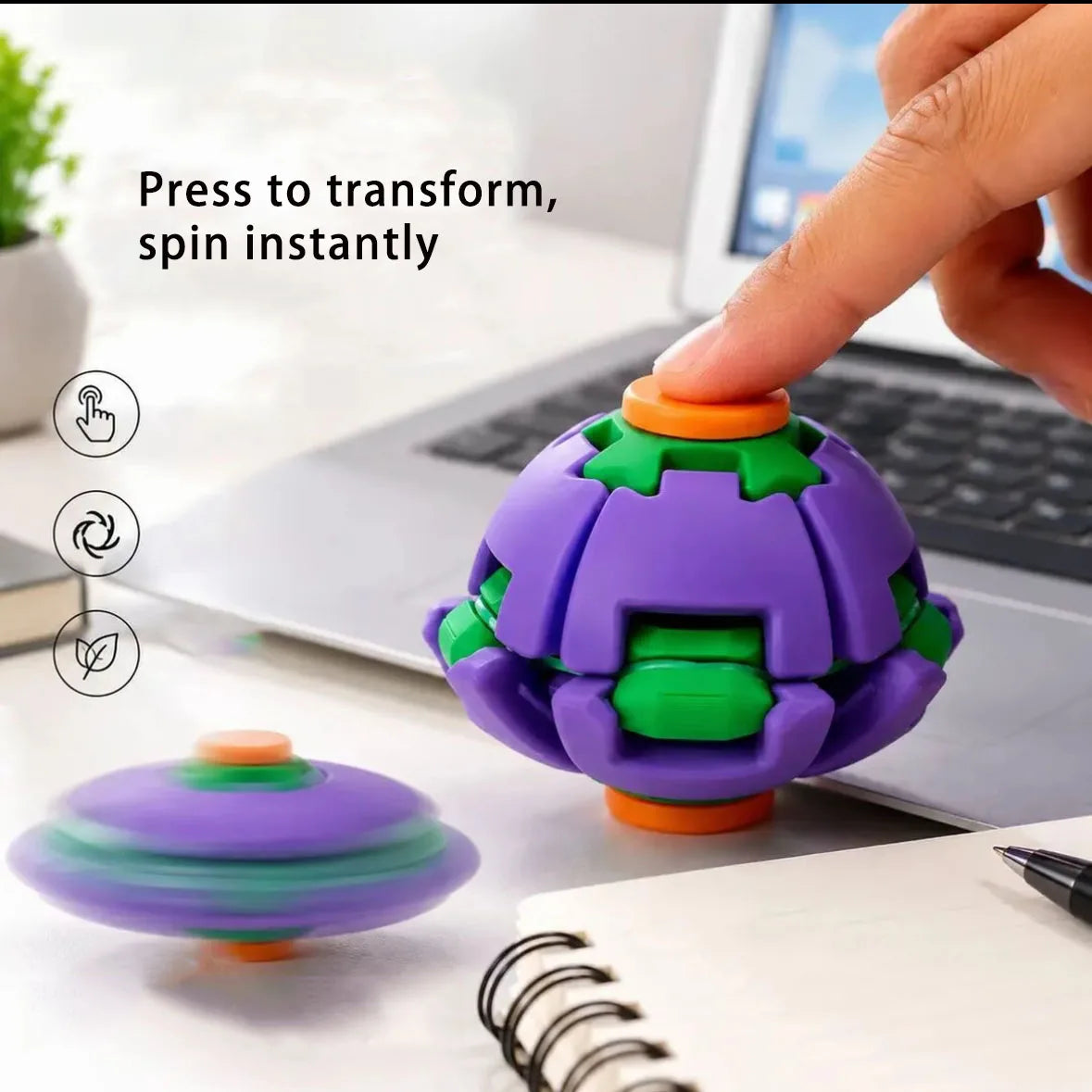 A purple and green fidget spinner ball is shown being pressed to transform and spin instantly on a desk.