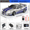 A silver 1/18 scale GTR R34 RC drift car with blue stripes is shown next to its remote, battery, accessories, and handbag.