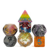A set of seven polyhedral resin dice in various colors including pink, red, blue, and gray.