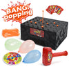 A box of party game components including balloons, a pop stick, and a circular game board.