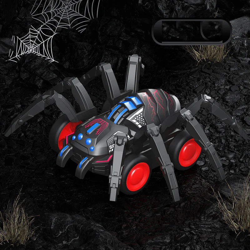 A black and blue inertia-powered spider crawling toy car is shown on a dark, rocky surface.