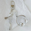 Silver beaded wing cross phone lanyard keychain with a clear plastic loop and microphone attachment