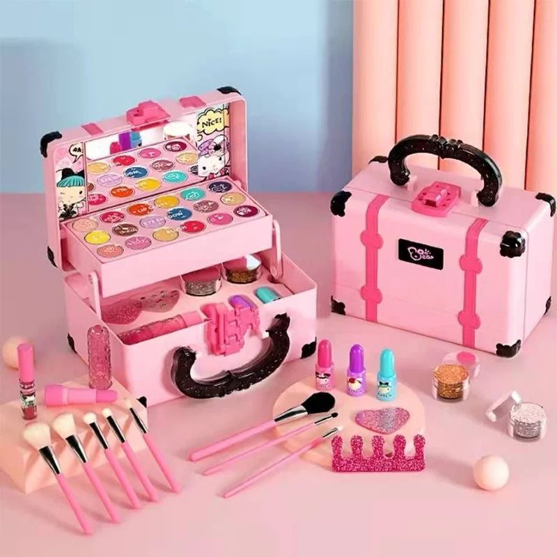 A pink princess pretend play makeup set with various cosmetic items and brushes displayed on a light pink surface.