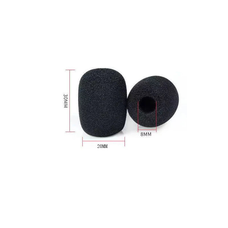 A black replacement microphone foam cover with a circular hole, shown next to a measurement scale.