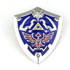 Silver enamel pin featuring a blue shield design with white and red details.