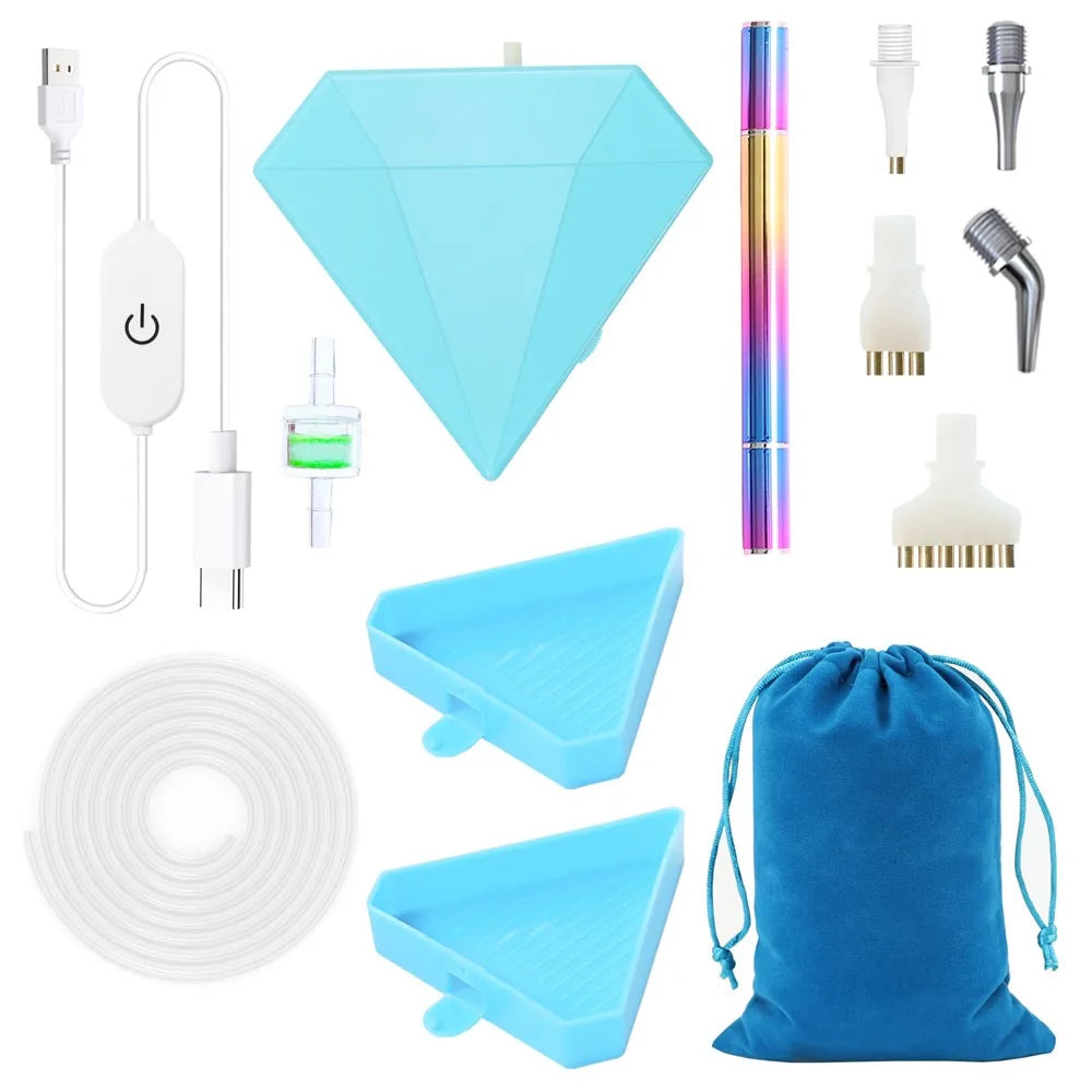 A set of electric diamond painting pens and tools including a USB suction tool, various tips, and a blue paint bag.