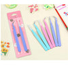 A set of precision stainless steel tweezers in various shades of purple and blue packaged for nail art and makeup.