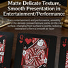 A close-up of a playing card featuring a detailed red and white pattern on a black background.