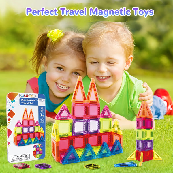 Two children play with a set of colorful mini magnetic tile building blocks for travel