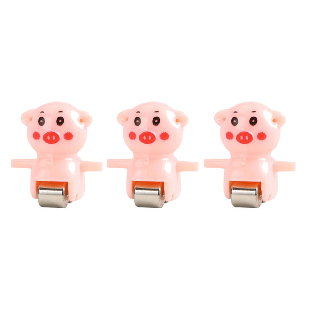 Three pink pig-shaped animal racing cars with silver slides and electric tracks.